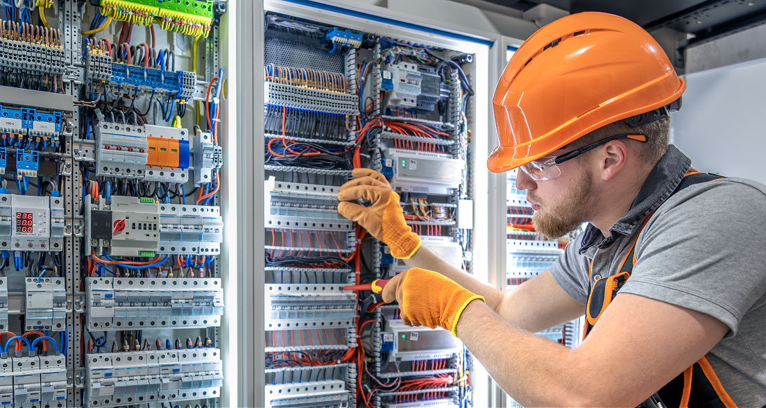 Electrician working on an electrical panel